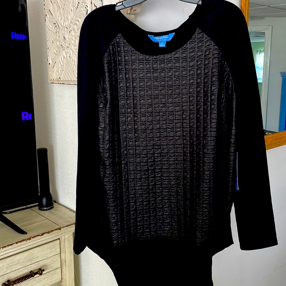 NWT super cool long sleeve top. Front looks like leather but is embossed fabric